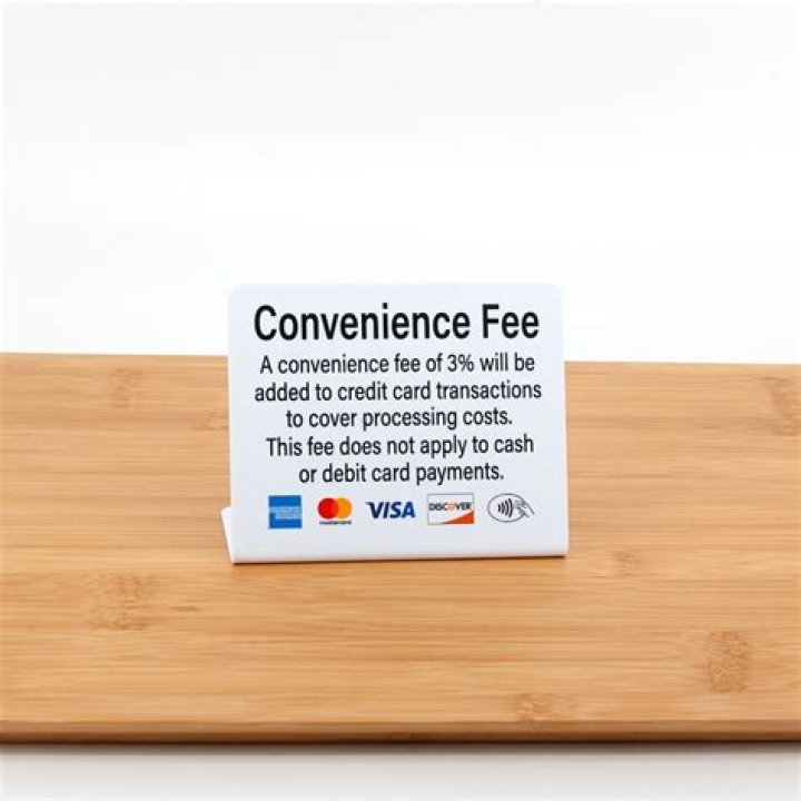 Can business charge fee for debit card?
