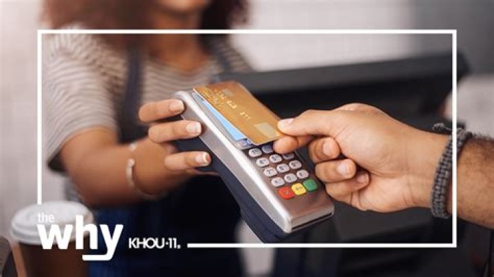 Why might someone want to make a purchase with a credit card rather than paying cash?